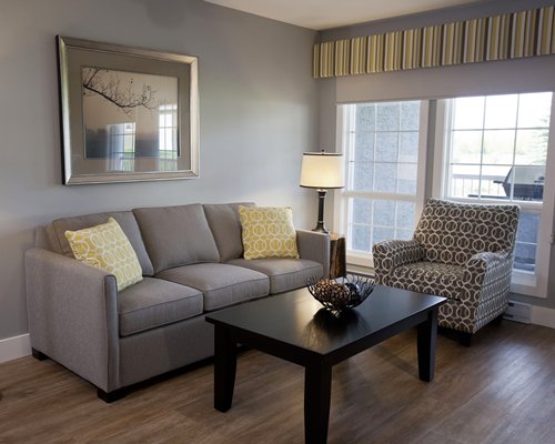 A well furnished living room with a pull out sofa.