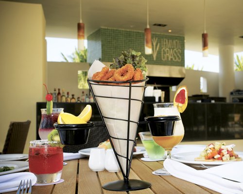Snack bar with food items and beverages on the table.
