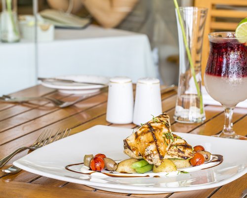 View of the food item and mocktail placed on a table in a fine dining restaurant.