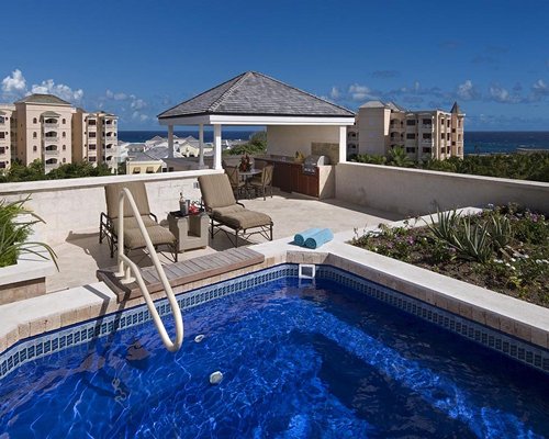 Rooftop hot tub with chaise lounge chairs at the resort.