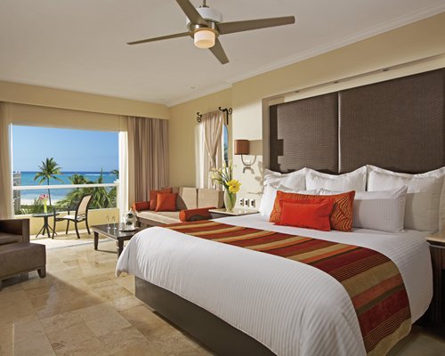 A well furnished bedroom with balcony.
