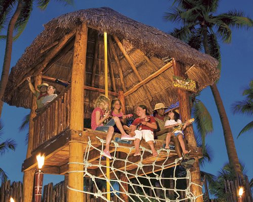 View of kids playing in a tree house.
