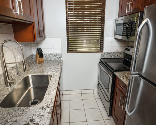 A well equipped kitchen with a microwave oven.