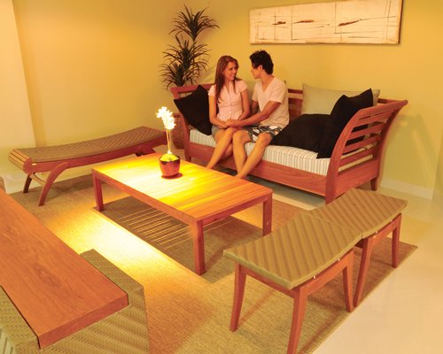 A couple in a well furnished lounge area.