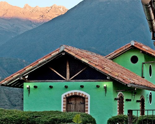 An exterior view of the resort units alongside the mountains.