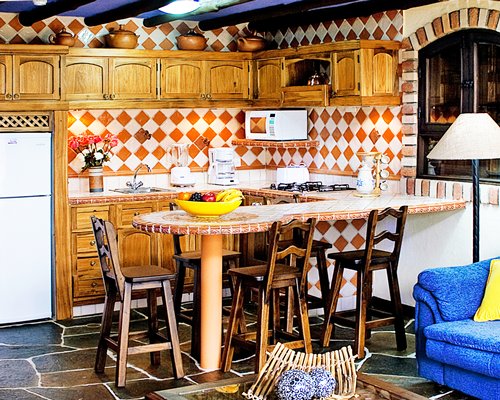 A well equipped kitchen and breakfast bar.