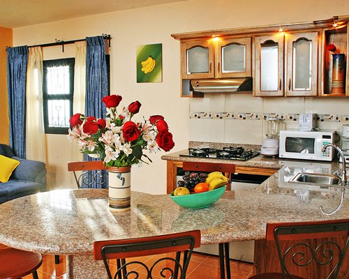 A well equipped kitchen and breakfast bar.