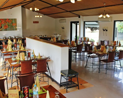 An indoor fine dining restaurant with an outside view.