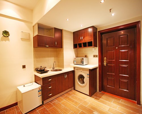 A well equipped kitchen with a microwave.
