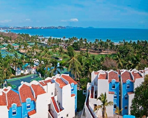 An aerial view of the resort property alongside the ocean.