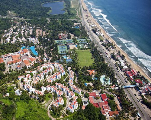 Bird's eye view of the Gran Festivall Resort alongside the ocean.