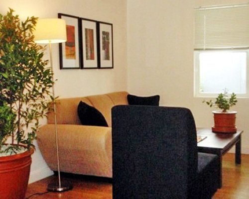 A well furnished living area with sofas.