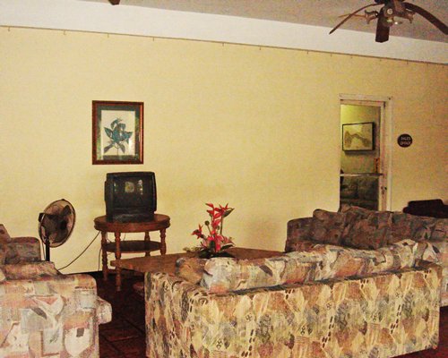 A well furnished living room with a television.