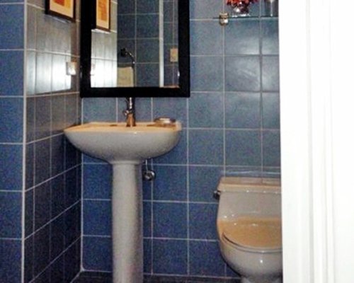 A bathroom with single sink vanity.