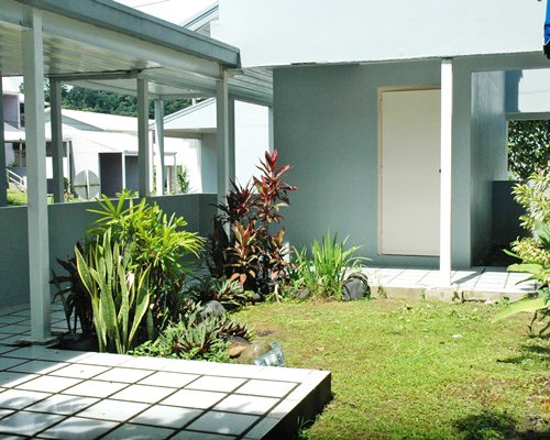 Resort outdoor area with shrubs and landscaping.