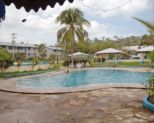 An indoor swimming pool with gazebos.