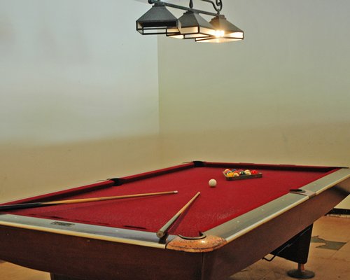 Indoor recreation room with pool table.