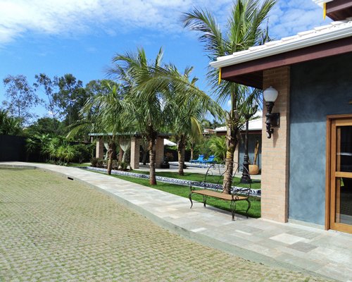 An exterior view of resort unit with trees.