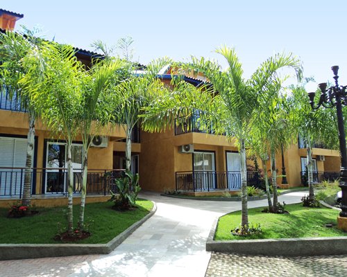 A paved pathway leading to the multiple units of the resort.