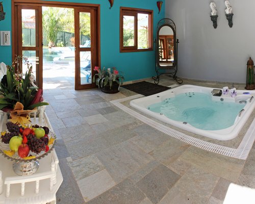 An indoor hot tub with a patio.
