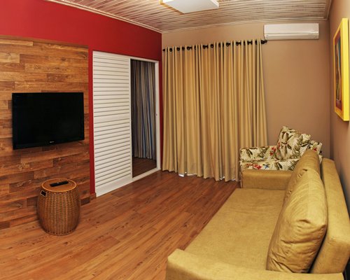 A well furnished living room with a television.