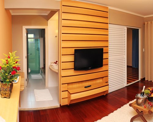 A well furnished living room with a television.