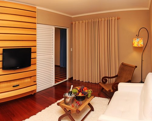 A well furnished living room with a television.