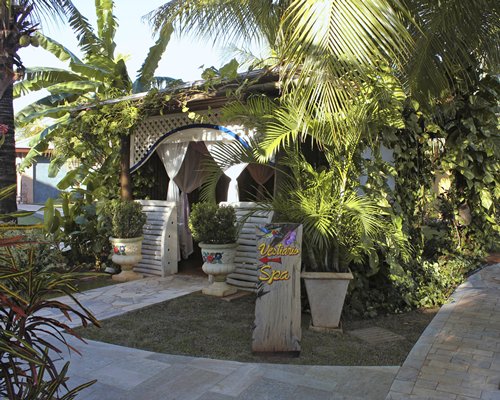 A pathway leading to an outdoor spa.