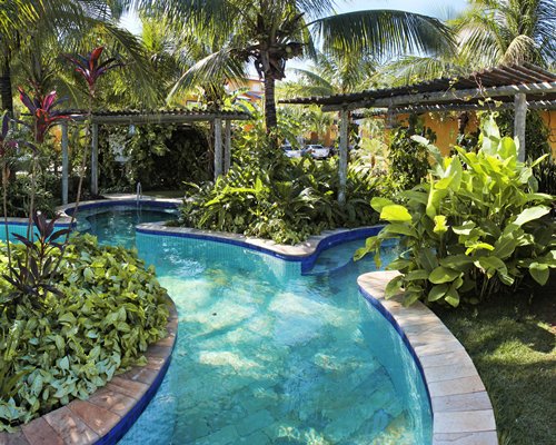 An outdoor pool alongside the resort unit.