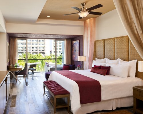 Luxury Bedroom with Ornate footrest at Secrets Vallarta Bay Puerto Vallarta