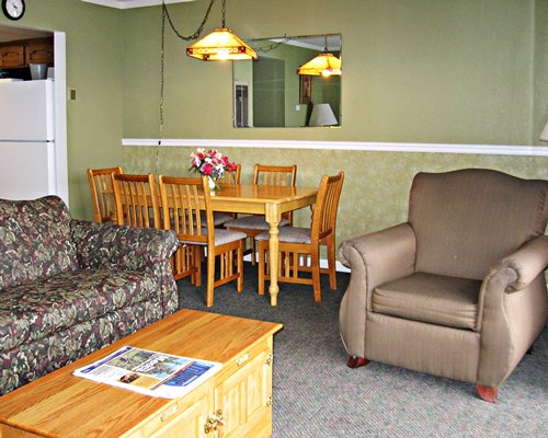 A well furnished living room and dining area.