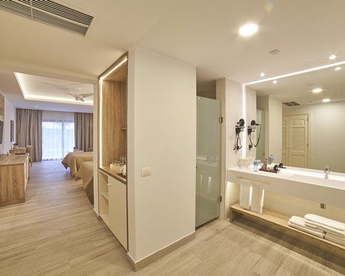A well furnished bedroom with two beds.