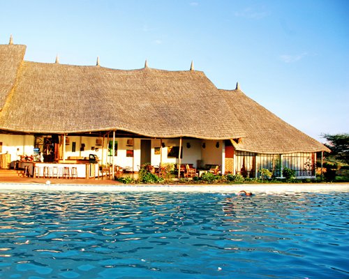 An exterior view of vacation units near the waterfront.
