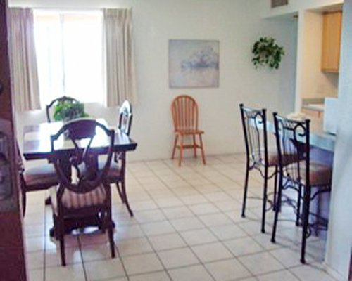 A well furnished dining room and breakfast bar.