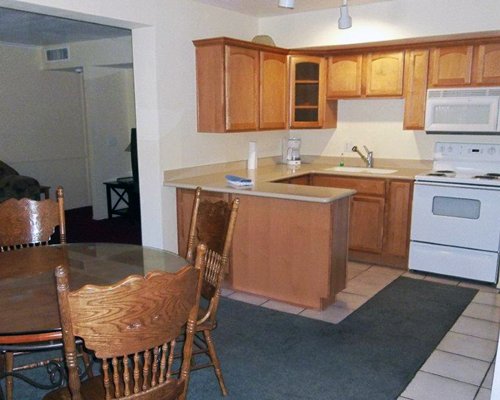 An open plan kitchen and dining area with a microwave oven.
