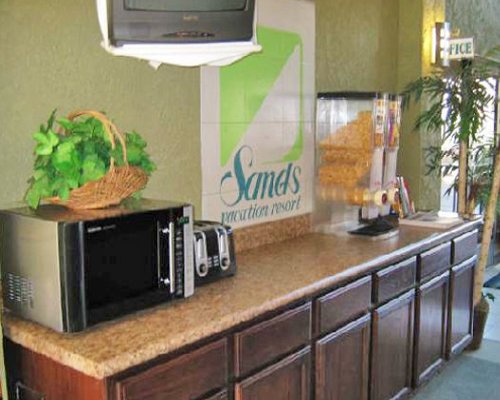 A well equipped kitchen with a microwave oven.