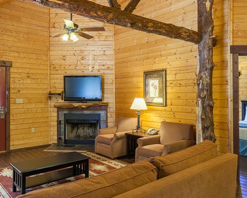 A balcony with patio and barbecue grill.