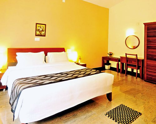 A well furnished bedroom with a double bed.