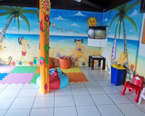 Indoor kids play area with a television.