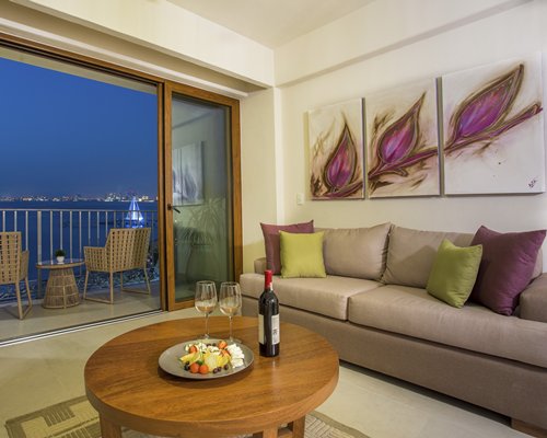 A well furnished living room with a balcony.