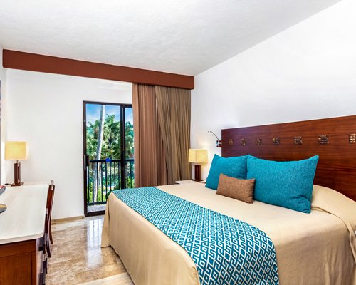 A well furnished bedroom with a television.