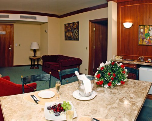 A well furnished living room and dining area.