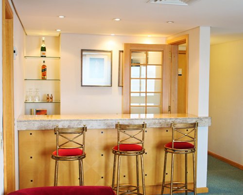 A well equipped kitchen and breakfast bar.