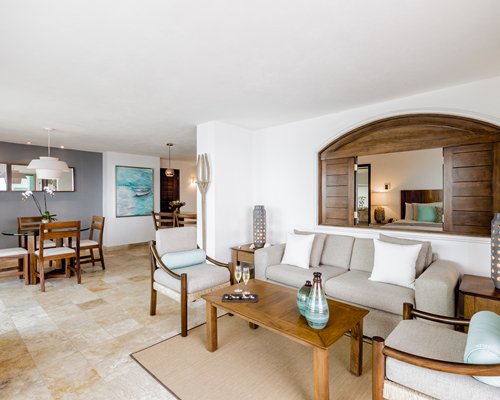 A well furnished living room and dining area.