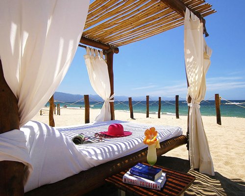 View of the beach with a beach bed.