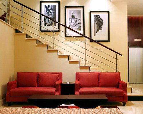 A well furnished living room with a staircase.