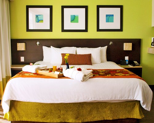 A well furnished bedroom with a king bed.
