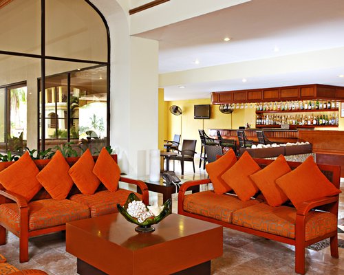 A well equipped outdoor bar with lounge access.