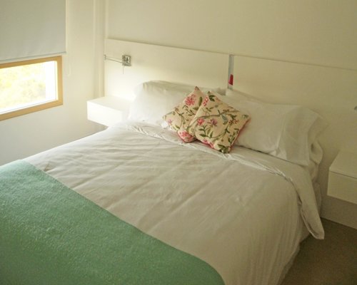A well furnished bedroom with double bed.