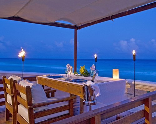 Outdoor private dining area alongside the beach.